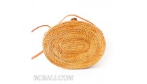 Oval rattan handbag ata hand woven leather handle 